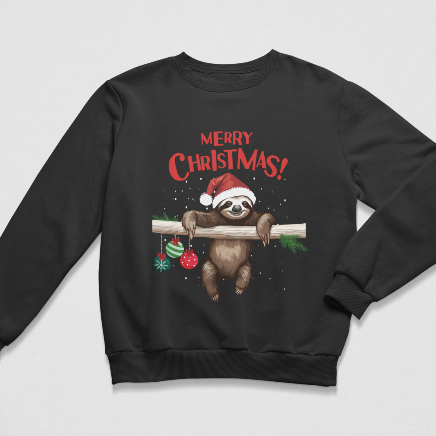 A kids black crewneck sweatshirt featuring a festive Christmas graphic of a sloth wearing a Santa hat and hanging from a branch with 'MERRY CHRISTMAS!' text above it, shown on a light grey background.