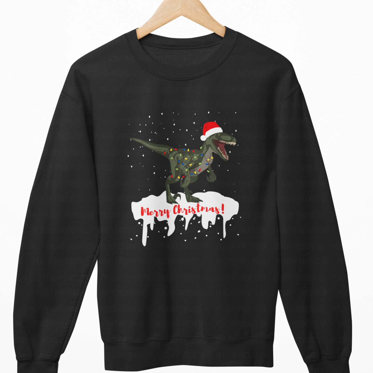 Black sweatshirt with a Christmas-themed design of a dinosaur and tree, on a white background.