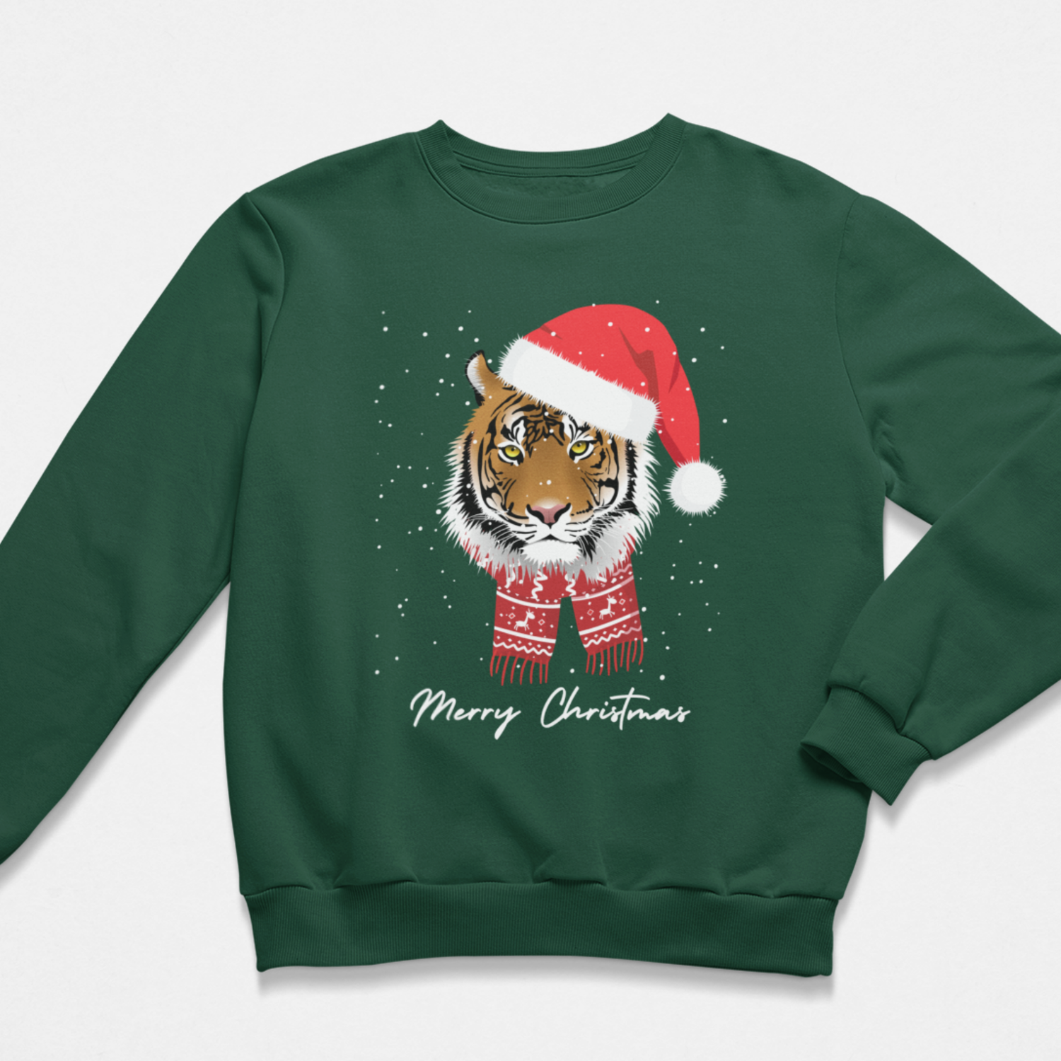 A kids dark green crewneck sweatshirt featuring a graphic of a tiger wearing a red Santa hat and matching red knit scarf, with 'Merry Christmas' written in white script below. The sweatshirt is displayed flat against a light grey background.