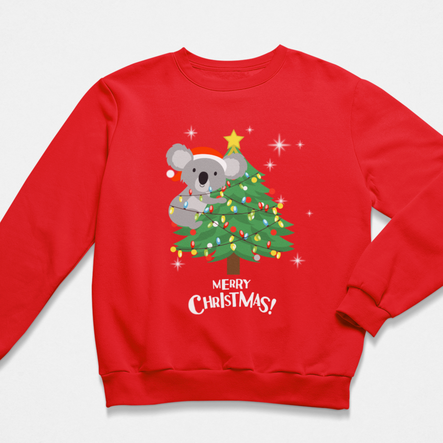 A kids red crewneck sweatshirt featuring a festive graphic of a gray koala wearing a Santa hat next to a decorated Christmas tree with the text 'MERRY CHRISTMAS!' printed below.