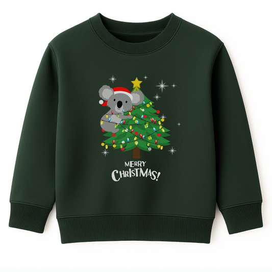 Kids dark green Christmas sweatshirt featuring a cute koala climbing a decorated Christmas tree with festive lights and the words “Merry Christmas.”