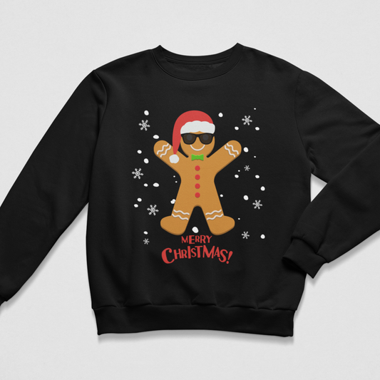 Kids black Christmas jumper featuring a cool gingerbread man in sunglasses and a Santa hat, surrounded by snowflakes with Merry Christmas text.