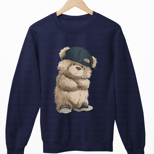Navy blue sweatshirt with a teddy bear wearing a cap on a white background