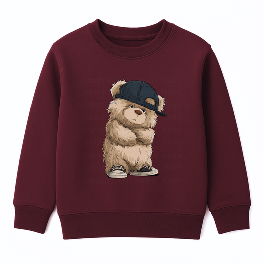 Burgundy children’s sweatshirt featuring urban teddy bear graphic wearing a sideways cap and sneakers.
