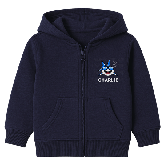 Kids navy zip-up hoodie featuring a small cool cartoon shark wearing sunglasses with personalised name ‘Charlie’ printed on the chest.