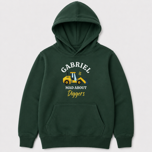 A dark green kids pullover hoodie with a front graphic that reads 'GABRIEL is MAD ABOUT Diggers' around a yellow construction digger illustration, shown on a light grey background.