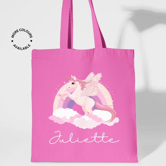 Girls pink cotton tote bag featuring a rainbow and unicorn print with the name “Juliette” in white script.