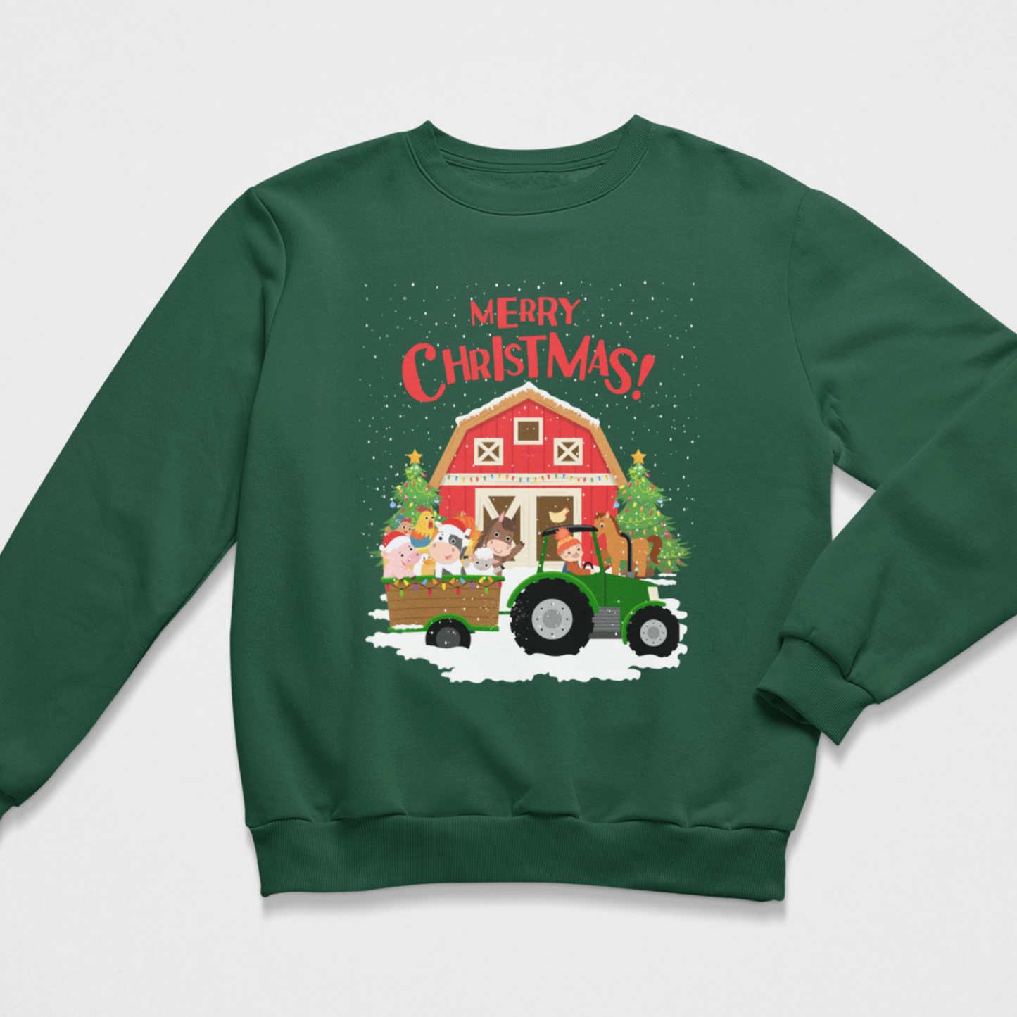 Flat lay view of a dark green kids Christmas jumper printed with a festive farm scene, including a green tractor, barn, and animals, with 'Merry Christmas!' script.