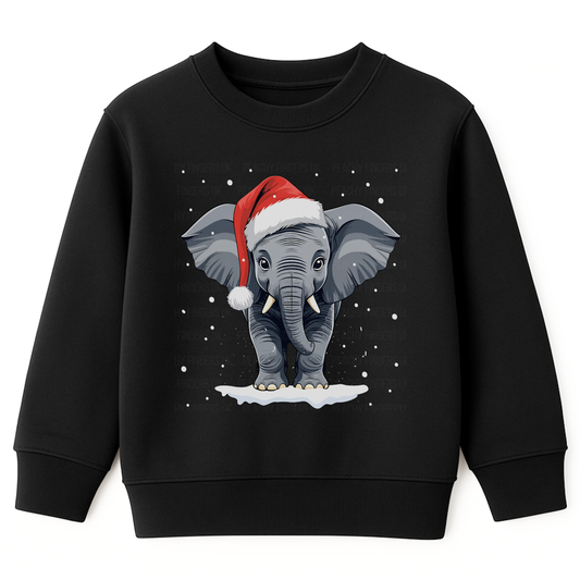 Kids black Christmas sweatshirt featuring a cute elephant wearing a Santa hat, surrounded by falling snow, standing on a patch of snow.
