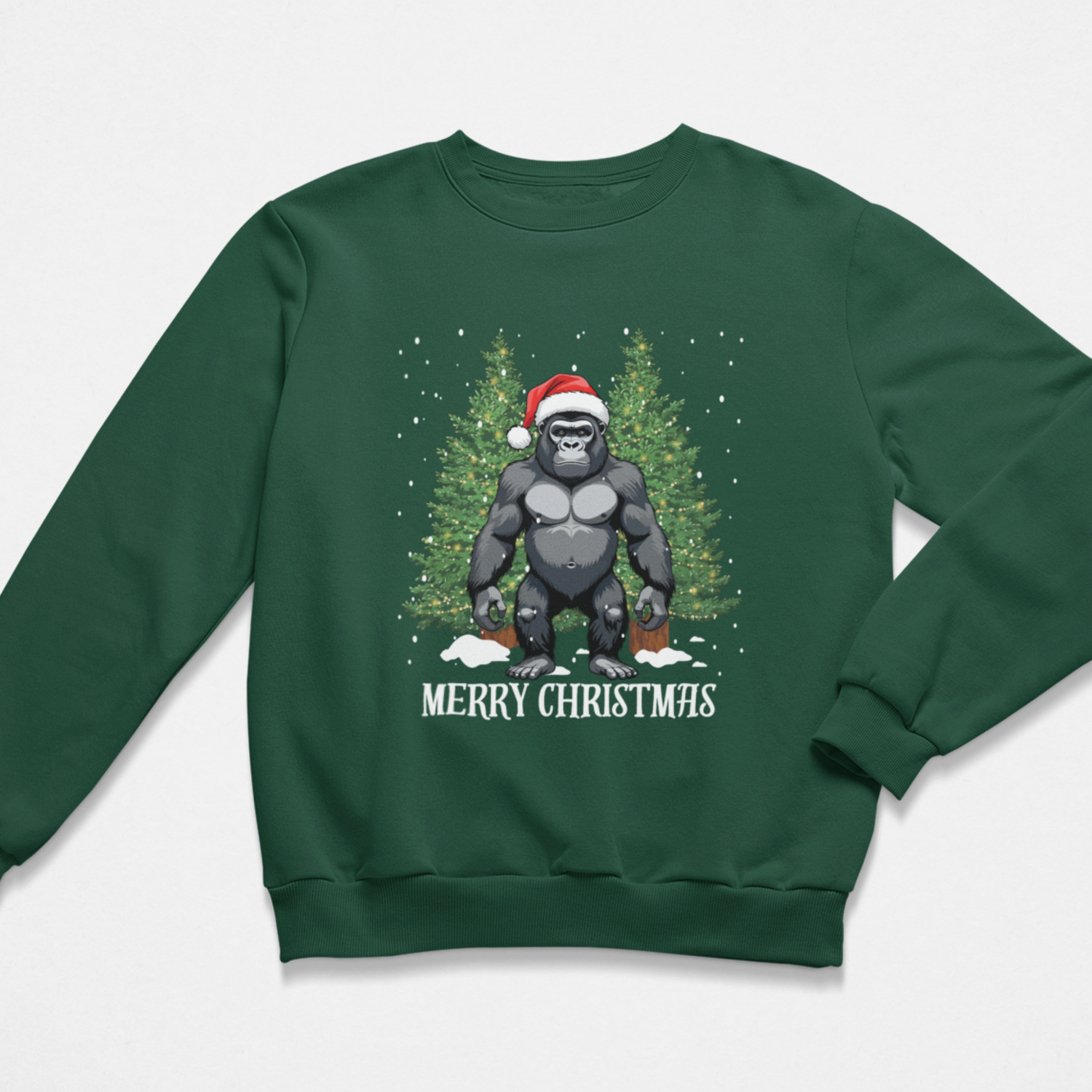 A kids dark green crewneck sweatshirt featuring a graphic of a gorilla wearing a Santa hat in front of a Christmas tree, with 'MERRY CHRISTMAS' printed below.
