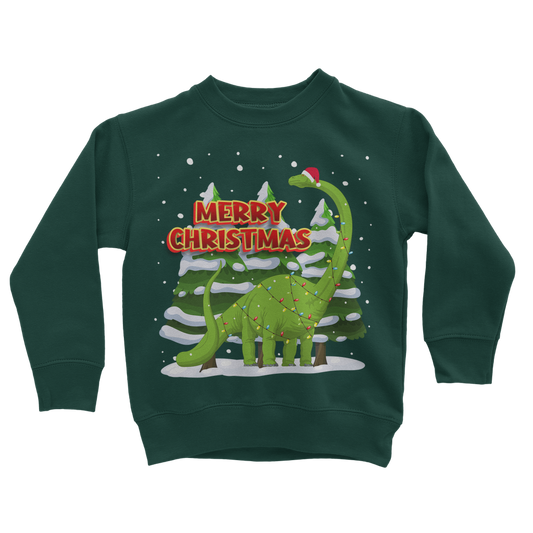 Kids dark green Christmas sweatshirt featuring a cute dinosaur wrapped in festive Christmas lights, standing in front of snowy pine trees with the text ‘Merry Christmas’ in bold red lettering."