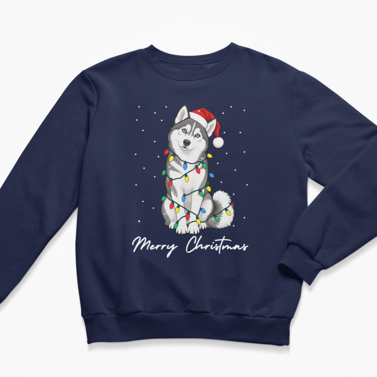 A kids navy blue crewneck sweatshirt featuring a festive graphic of a husky dog wearing a red Santa hat and wrapped in colourful Christmas lights, with 'Merry Christmas' written below in white script.