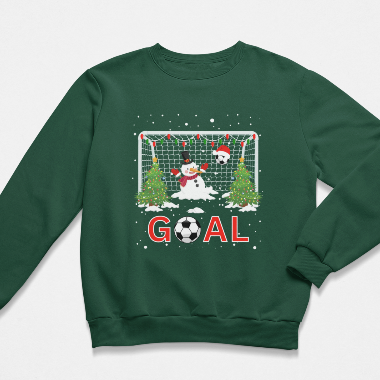 Children's dark green crewneck sweatshirt featuring a festive Christmas soccer graphic on the front. The graphic features a snowman goalkeeper and a soccer ball in front of a goal net with snow-covered trees and the word 'GOAL' in red letters.