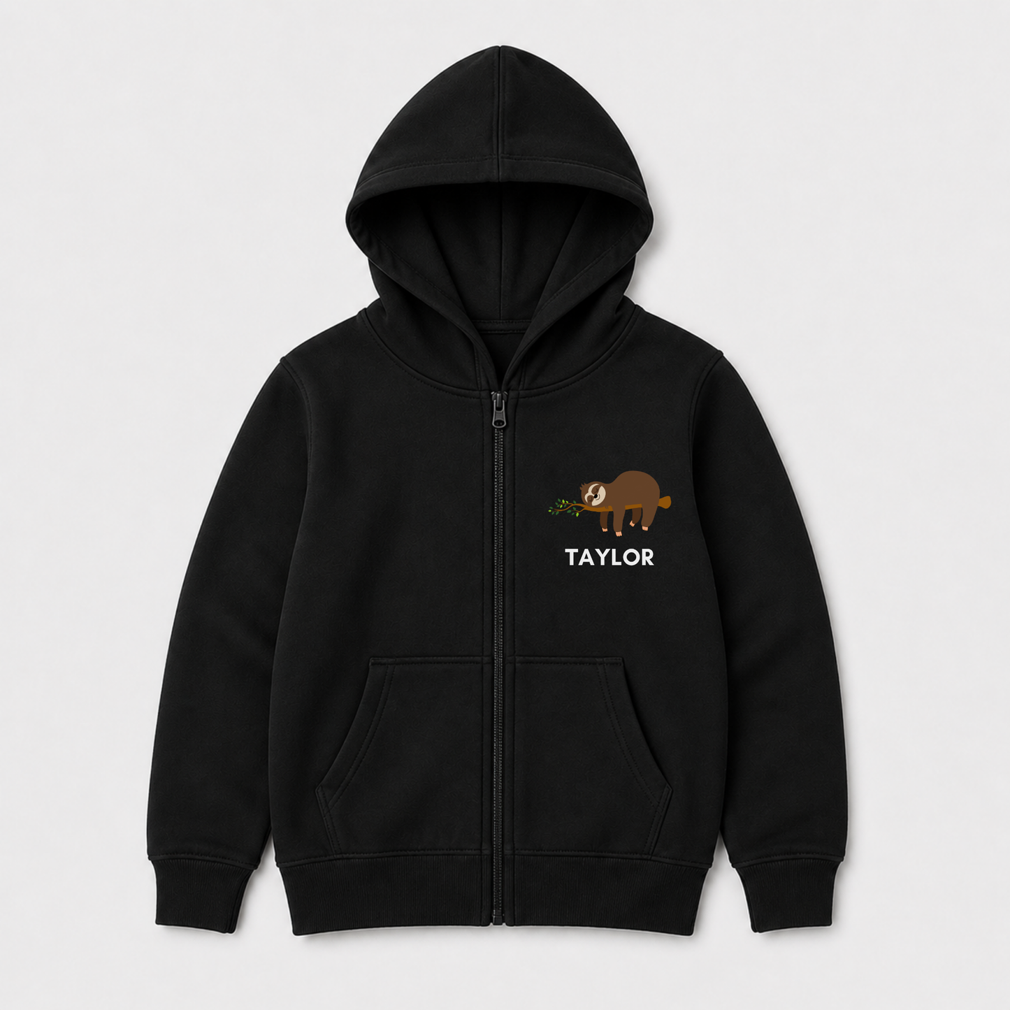 Black personalised kids zip hoodie with a small brown sloth sleeping on a leafy branch and the name Taylor printed underneath.