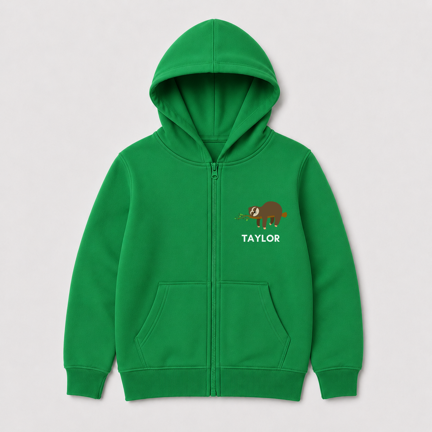Bright green children’s zip hoodie featuring a small sloth chest print with leafy detail and personalised name Taylor below. 