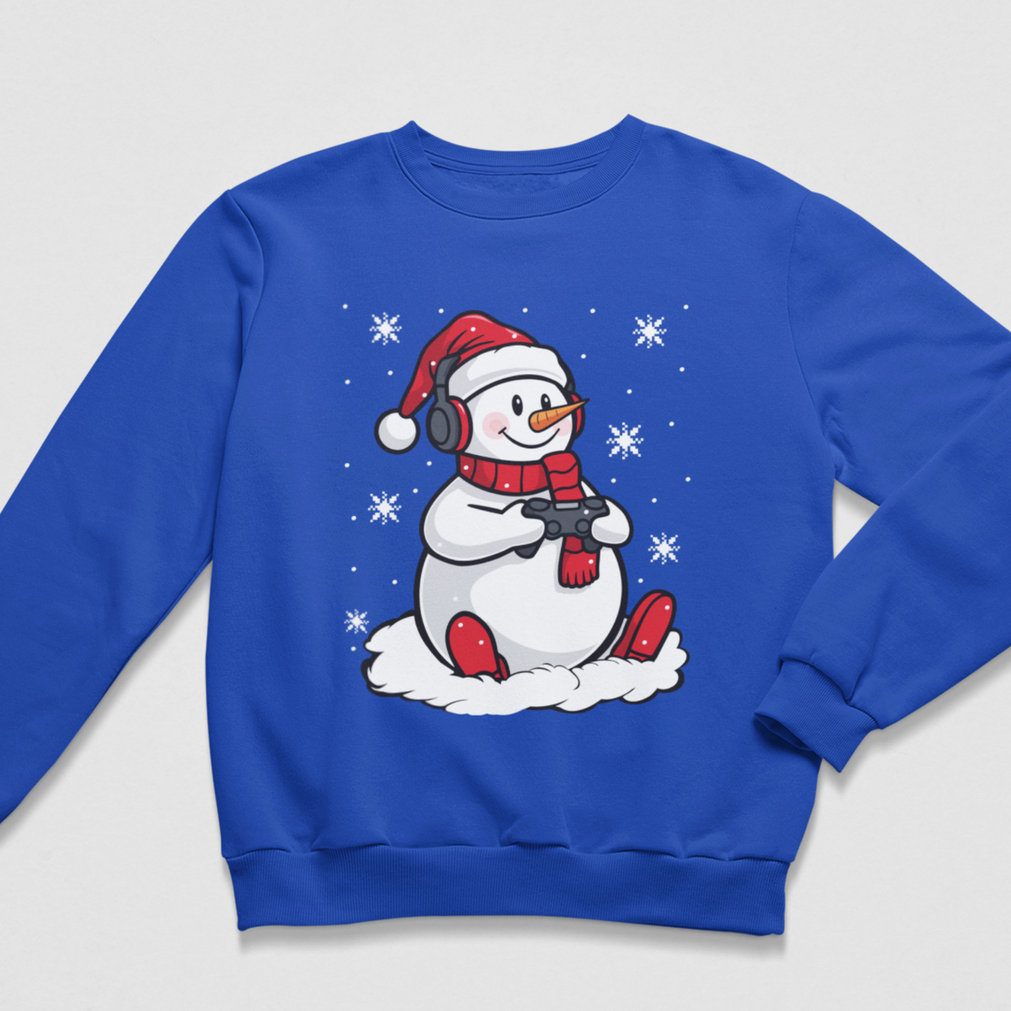 Kids royal-blue Christmas jumper featuring a gaming snowman wearing headphones and holding a controller.