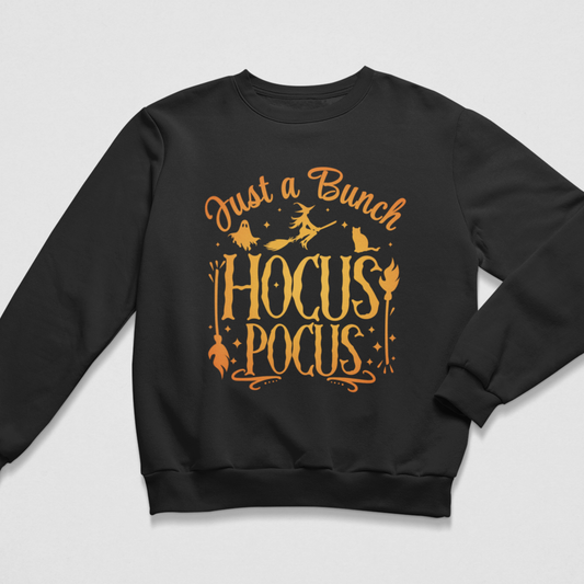 Kids black Hocus Pocus Halloween sweatshirt flat lay with orange witch, ghost and cat graphic.