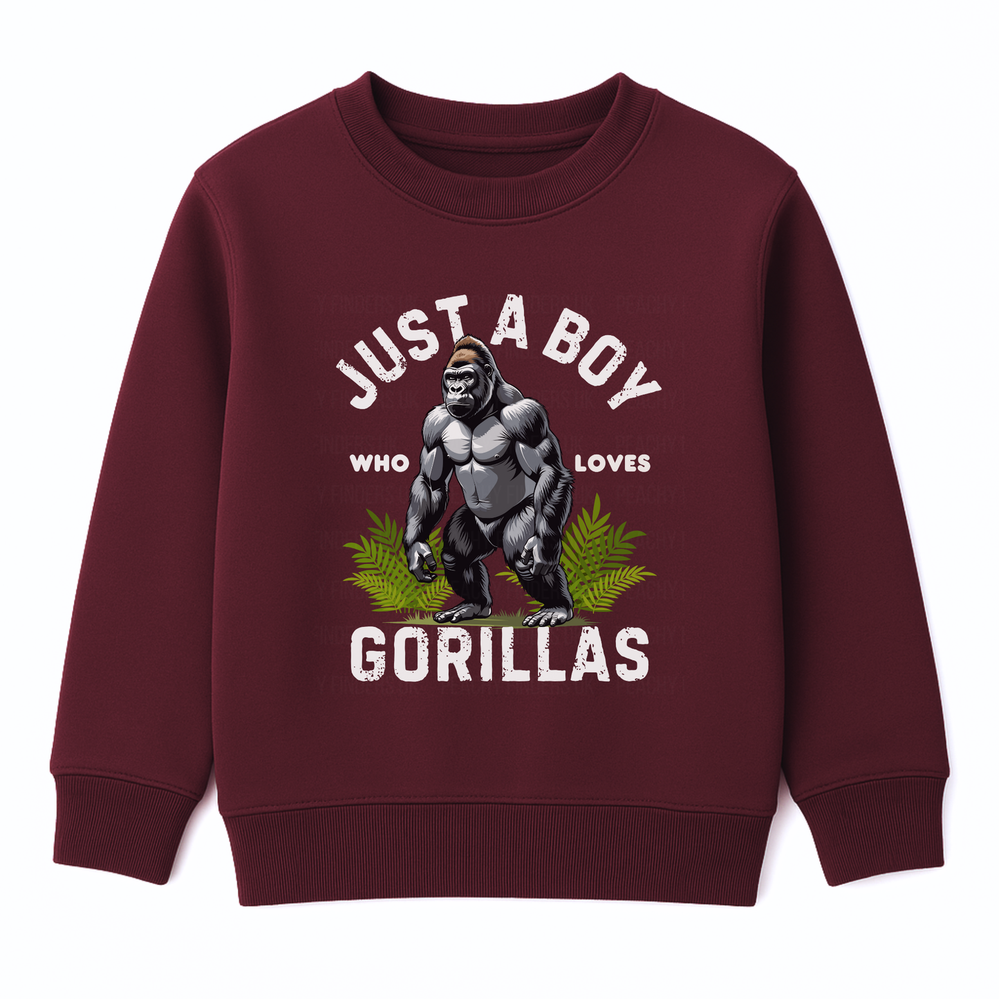 Kids burgundy sweatshirt with “Just a Boy Who Loves Gorillas” text and gorilla graphic over green leaves, flat lay on white background.
