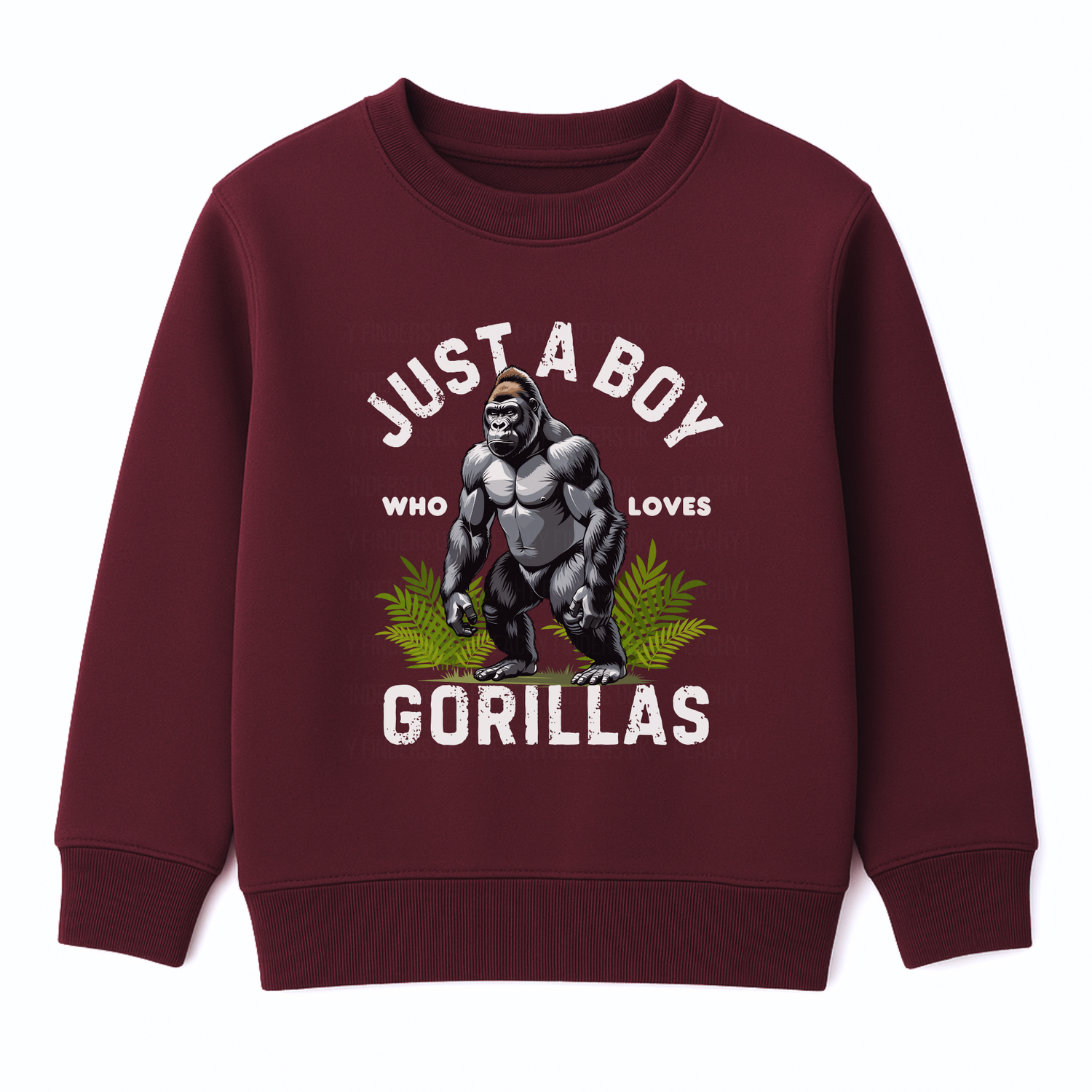 Kids burgundy sweatshirt with “Just a Boy Who Loves Gorillas” text and gorilla graphic over green leaves, flat lay on white background.