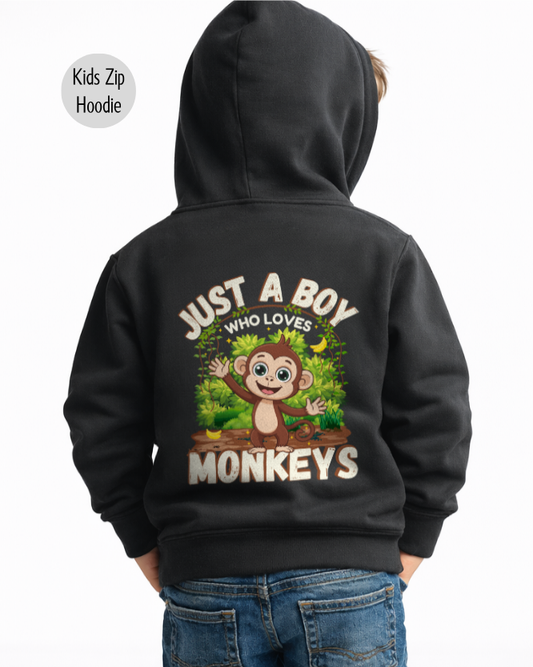Boy wearing black kids zip hoodie with Just A Boy Who Loves Monkeys cartoon monkey back graphic, back view studio photo
