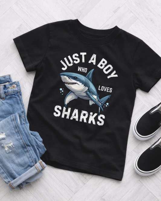 Kids black shark t-shirt with bold graphic text, casual outfit flat lay with jeans and shoes