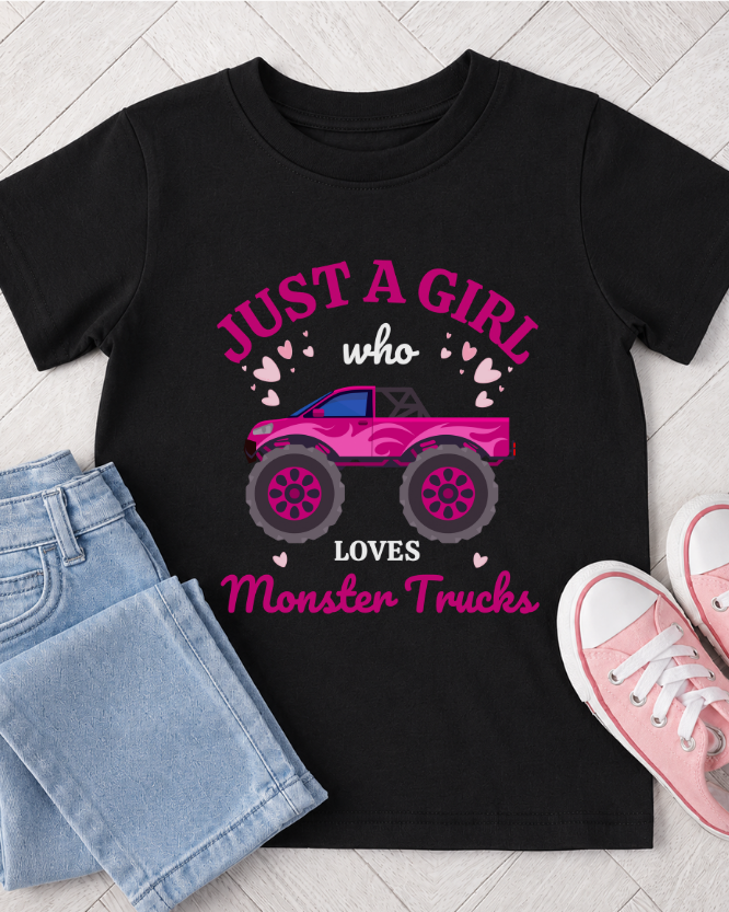 Black girls monster truck T-shirt with light blue jeans and pink trainers flat lay