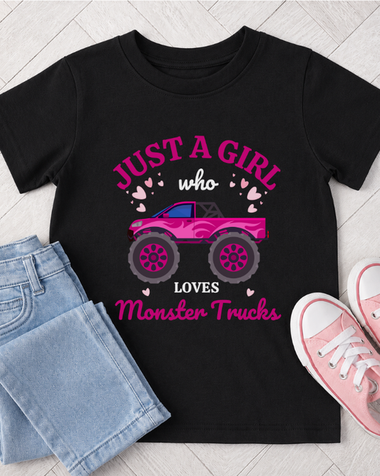 Black girls monster truck T-shirt with light blue jeans and pink trainers flat lay