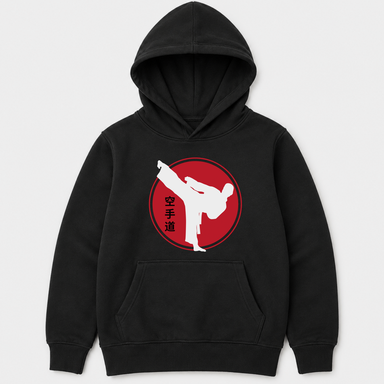 Children’s karate pullover hoodie in black featuring a bold red circle graphic with white karate kick silhouette and Japanese kanji lettering on the front.