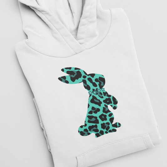 A child's white hoodie folded with teal  and black leopard print bunny rabbit with flowers graphic