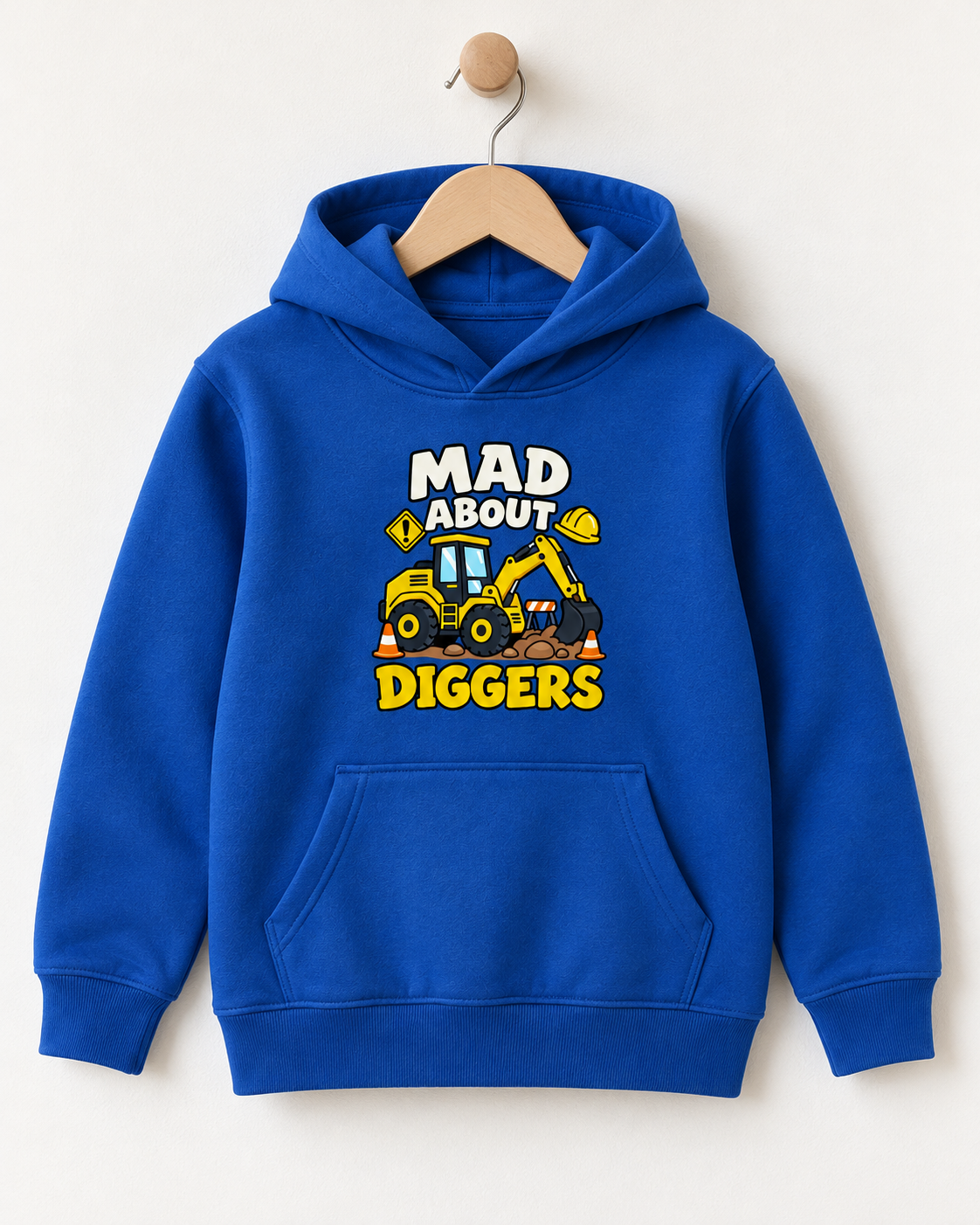 A royal blue kids' pullover hoodie hanging on a wooden hanger against a light beige wall. The hoodie features a graphic print on the chest with the text 'MAD ABOUT DIGGERS' in white and yellow, surrounding a cartoon illustration of a yellow excavator.