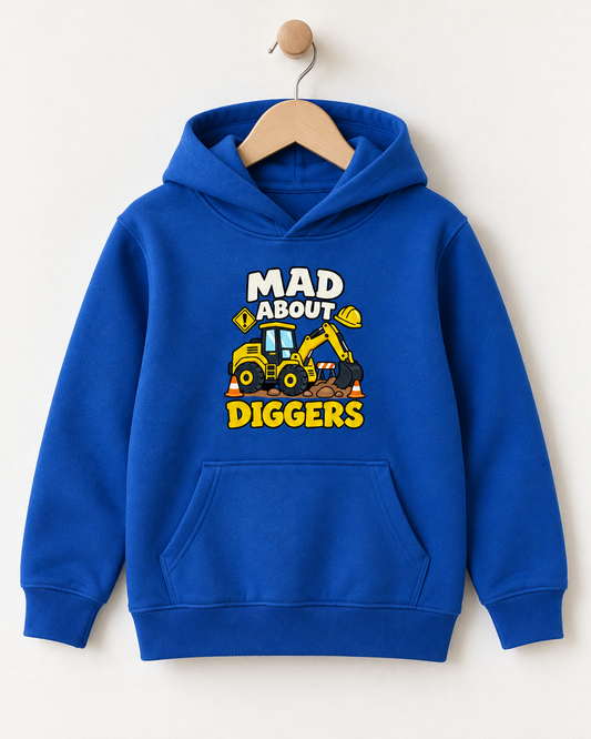 A royal blue kids' pullover hoodie hanging on a wooden hanger against a light beige wall. The hoodie features a graphic print on the chest with the text 'MAD ABOUT DIGGERS' in white and yellow, surrounding a cartoon illustration of a yellow excavator.
