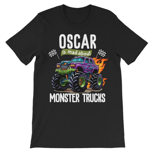 Black personalised boys T-shirt on a wooden hanger featuring a colourful monster truck with flames, racing flags and the name Nolan above the “is mad about Monster Trucks” design.