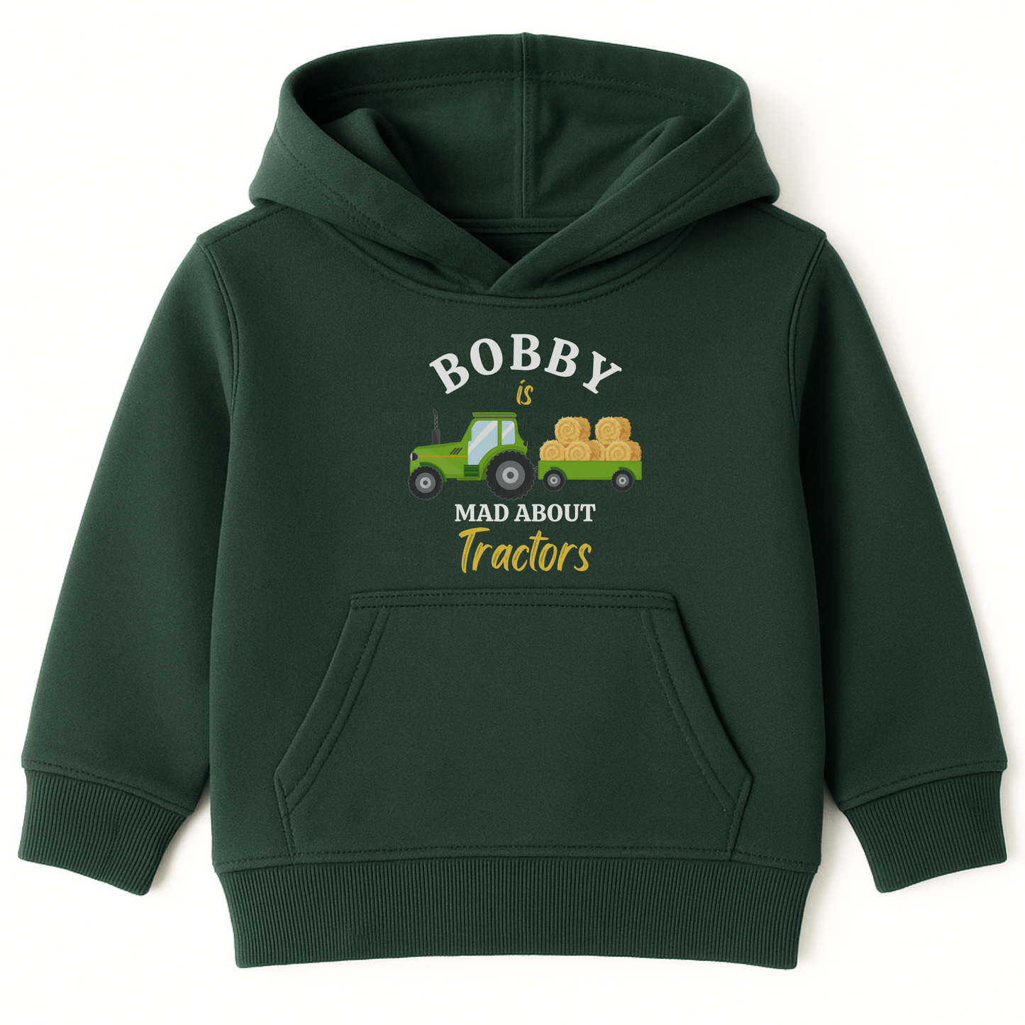Dark green kids hoodie with “Bobby is Mad About Tractors” slogan and green tractor with hay bales on the front.