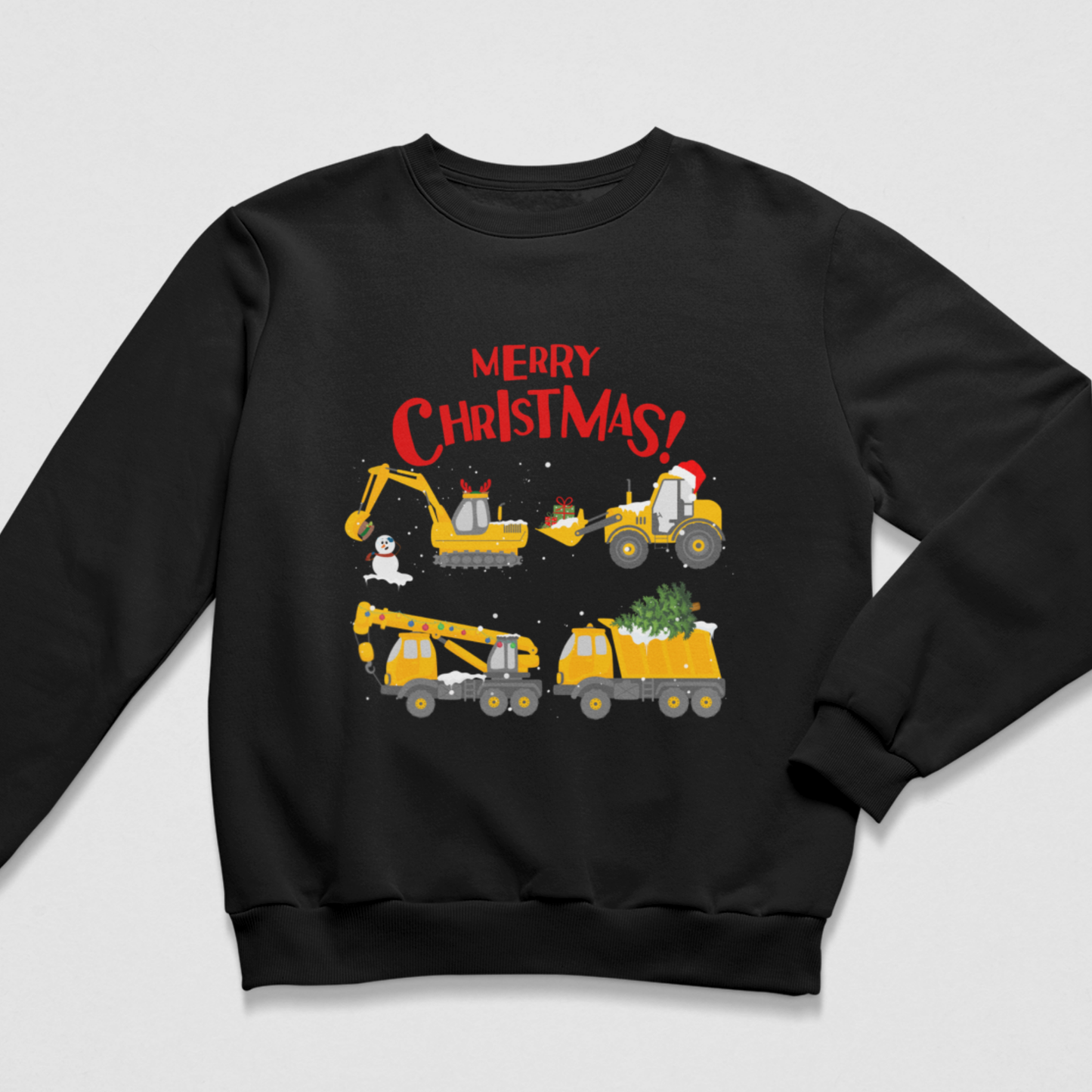 A kids black crewneck sweatshirt featuring a festive Christmas graphic with construction vehicles and the text 'MERRY CHRISTMAS!' in red, displayed on a light grey background.