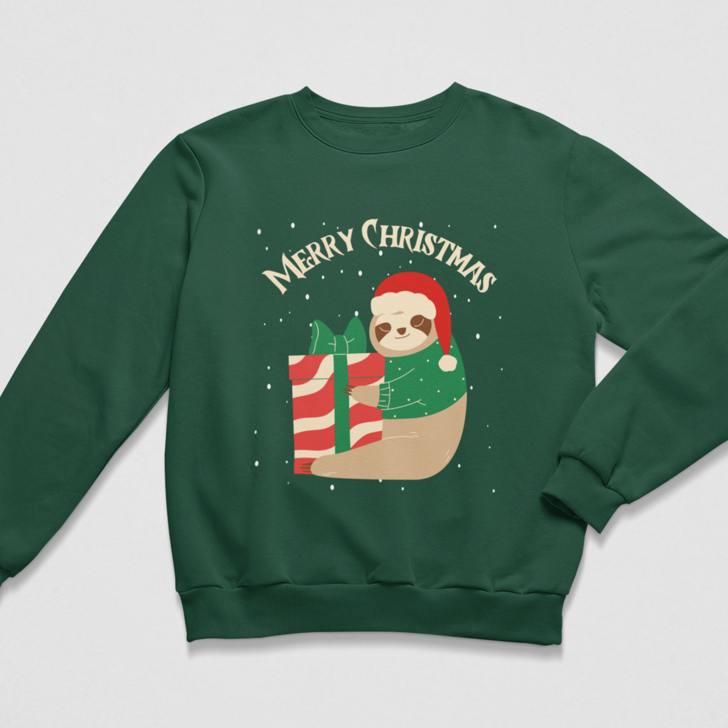 A kids dark green crewneck sweatshirt featuring a festive Christmas graphic of a sloth in a red Santa hat hugging a gift box with bow, 'Merry Christmas' written above in cream text.