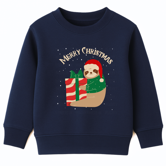 Kids navy Christmas sweatshirt featuring a cute sloth wearing a Santa hat and festive jumper, hugging a large red and white gift box with snow falling behind.