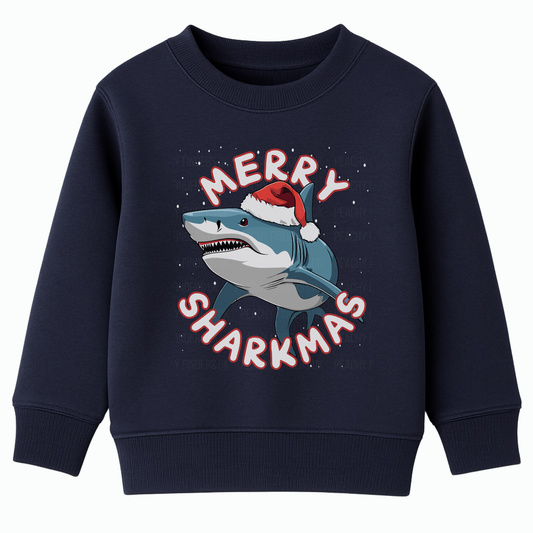 Black navy Christmas sweatshirt featuring a smiling shark wearing a Santa hat with falling snow and the text “Merry Sharkmas”.