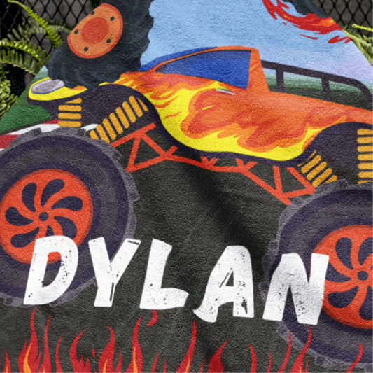 Custom printed Monster Truck beach towel with the name "Dylan" on it