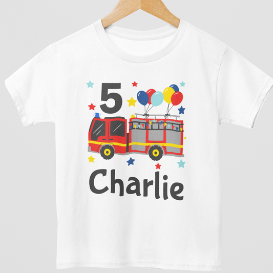 Kids birthday T-shirt in white with red fire engine, colourful balloons, stars, number 5 and personalised name Charlie printed on the front.