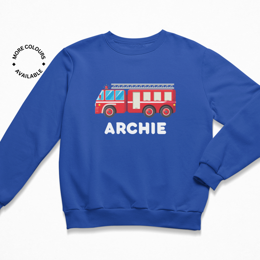 Kids sweatshirt in royal blue with bright red fire engine graphic and personalised name 'Archie' printed in white text below.