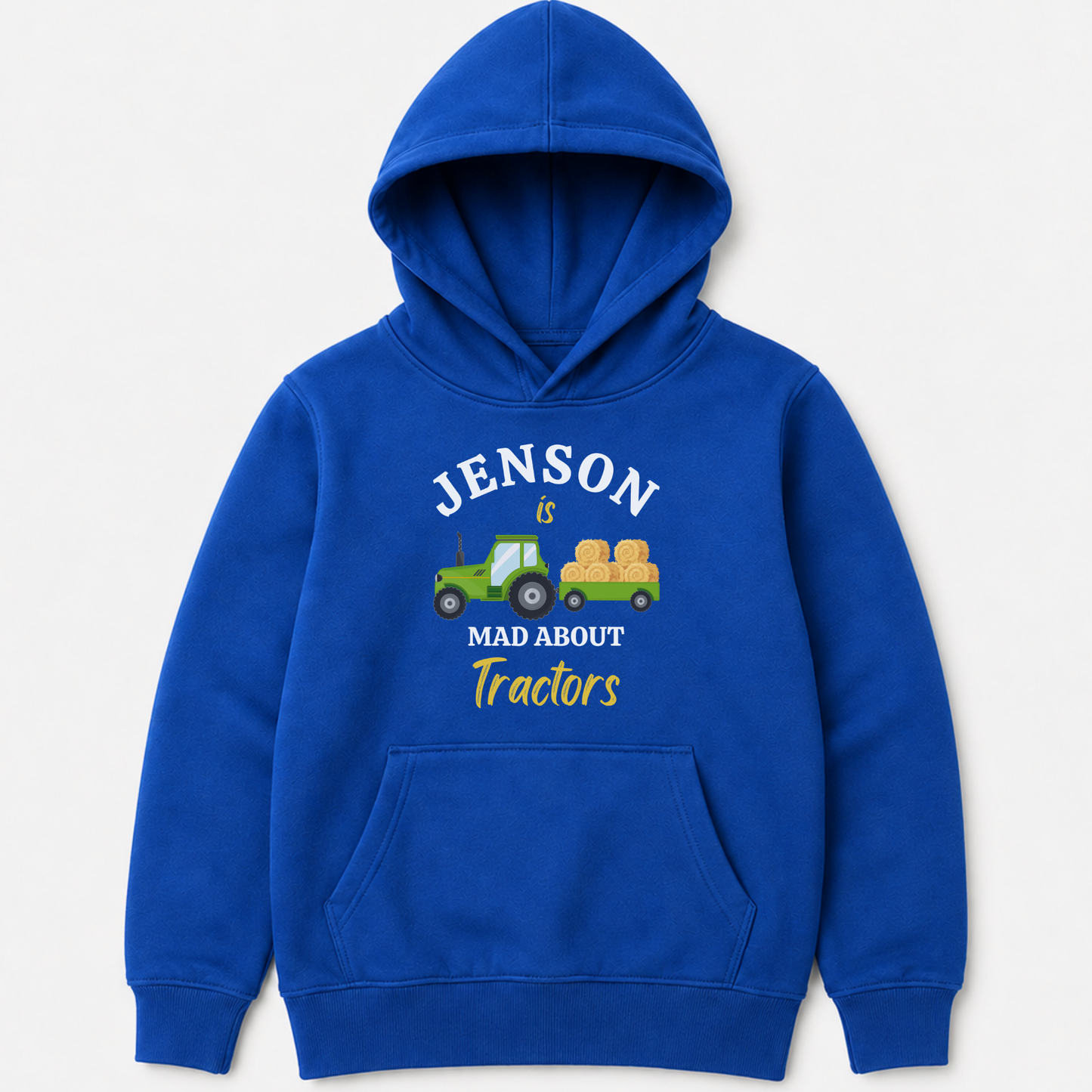 A royal blue kids pullover hoodie with a custom graphic on the chest. The graphic features a green tractor pulling a yellow hay cart, with the text 'JENSON IS MAD ABOUT Tractors' in white and yellow lettering.