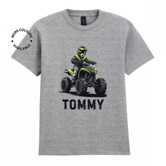 Gray t-shirt with graphic of person on ATV and 'Tommy' text, on a white background
