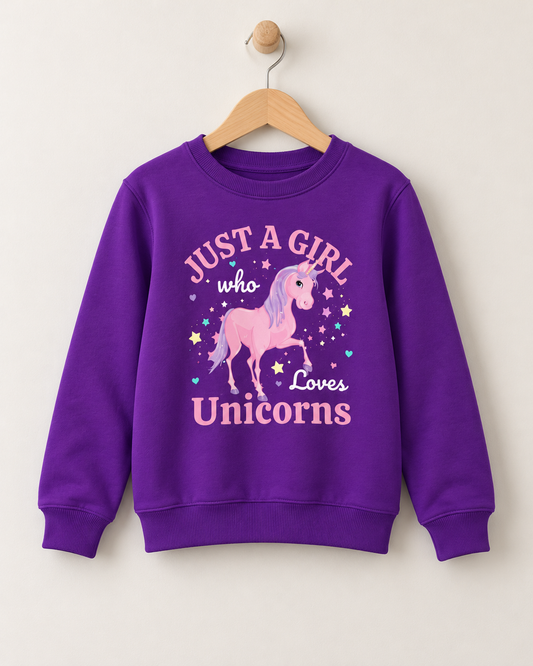 Purple kids crewneck sweatshirt hanging on a wooden hanger, featuring a pink unicorn illustration with a lilac mane, pastel stars, and the text "Just a Girl Who Loves Unicorns