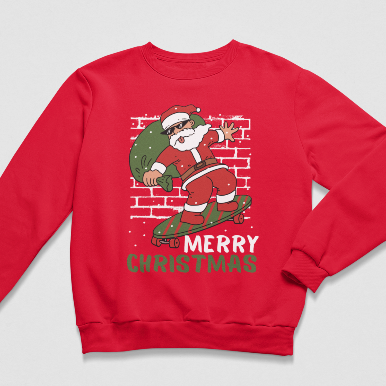 A kids red crewneck sweatshirt featuring a festive graphic of Santa Claus dancing on a skateboard while carrying a green Christmas tree sack, with the text 'MERRY CHRISTMAS' printed below against a light grey background.
