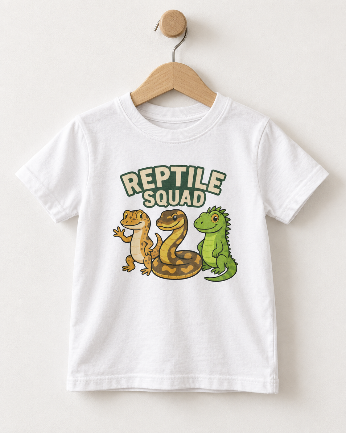 White kids Reptile Squad T-shirt on wooden hanger with gecko, snake and green lizard print