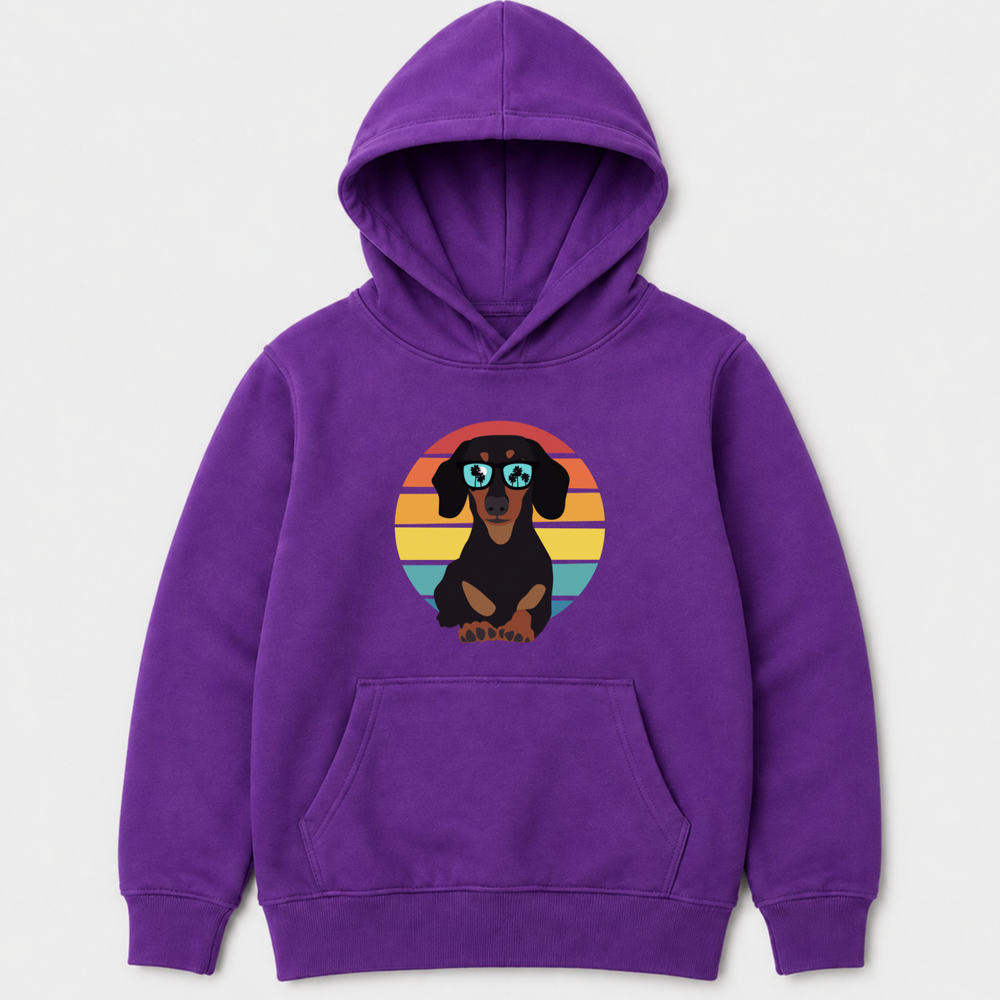 A purple kids pullover hoodie featuring a graphic of a dachshund wearing sunglasses against a retro sunset background, displayed on a light grey background.