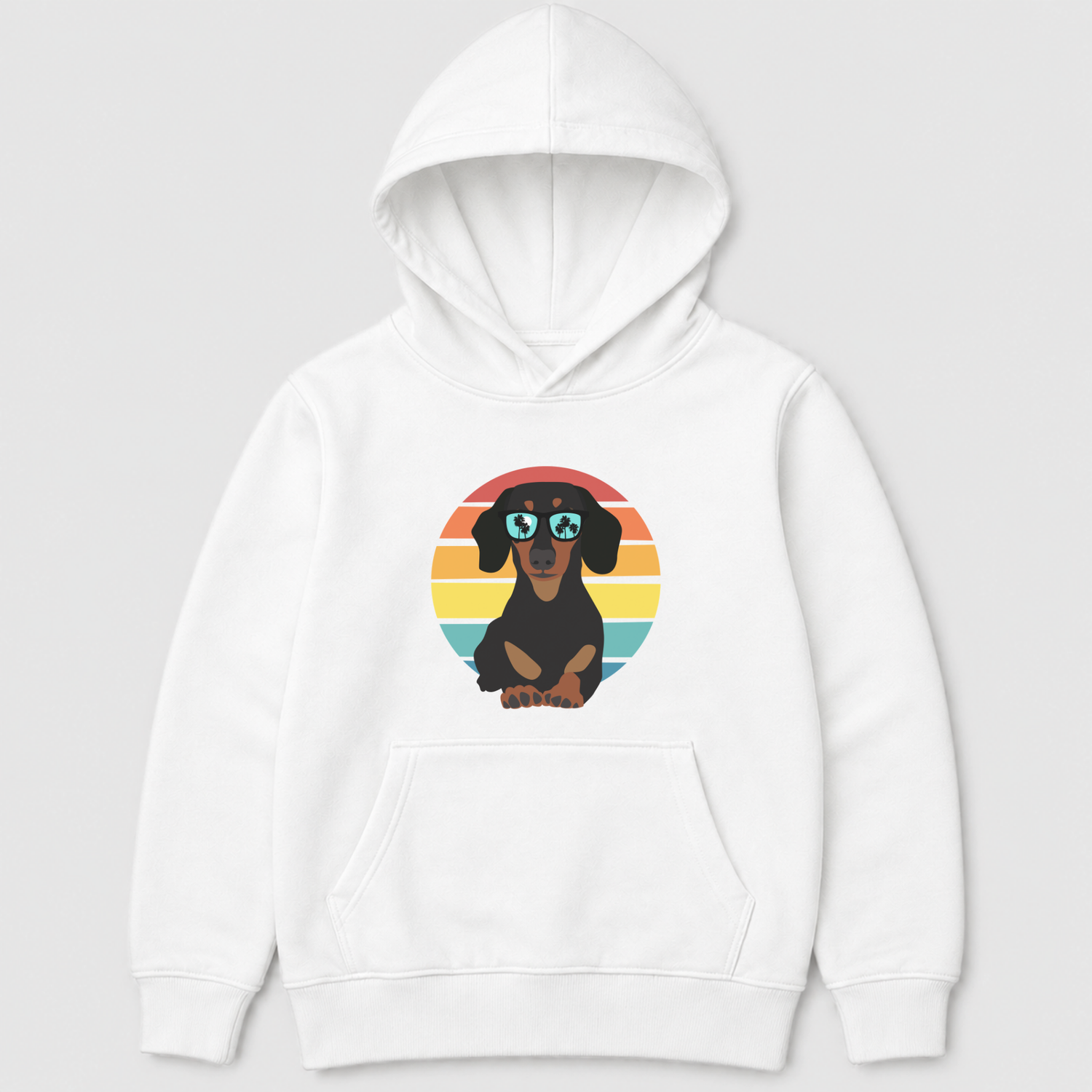 A kids white pullover hoodie featuring a cartoon dachshund wearing round sunglasses, set against a retro sunset circle graphic on the chest, displayed on a neutral light grey background.