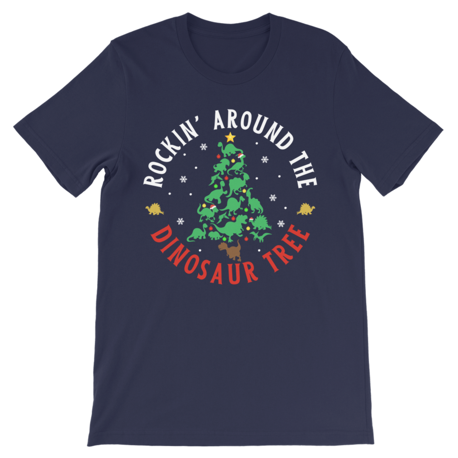 A kids navy blue short-sleeve t-shirt with a circular graphic on the chest featuring a green dinosaur Christmas tree, white text reading 'ROCKIN' AROUND THE', and red text reading 'DINOSAUR TREE' on a white background.