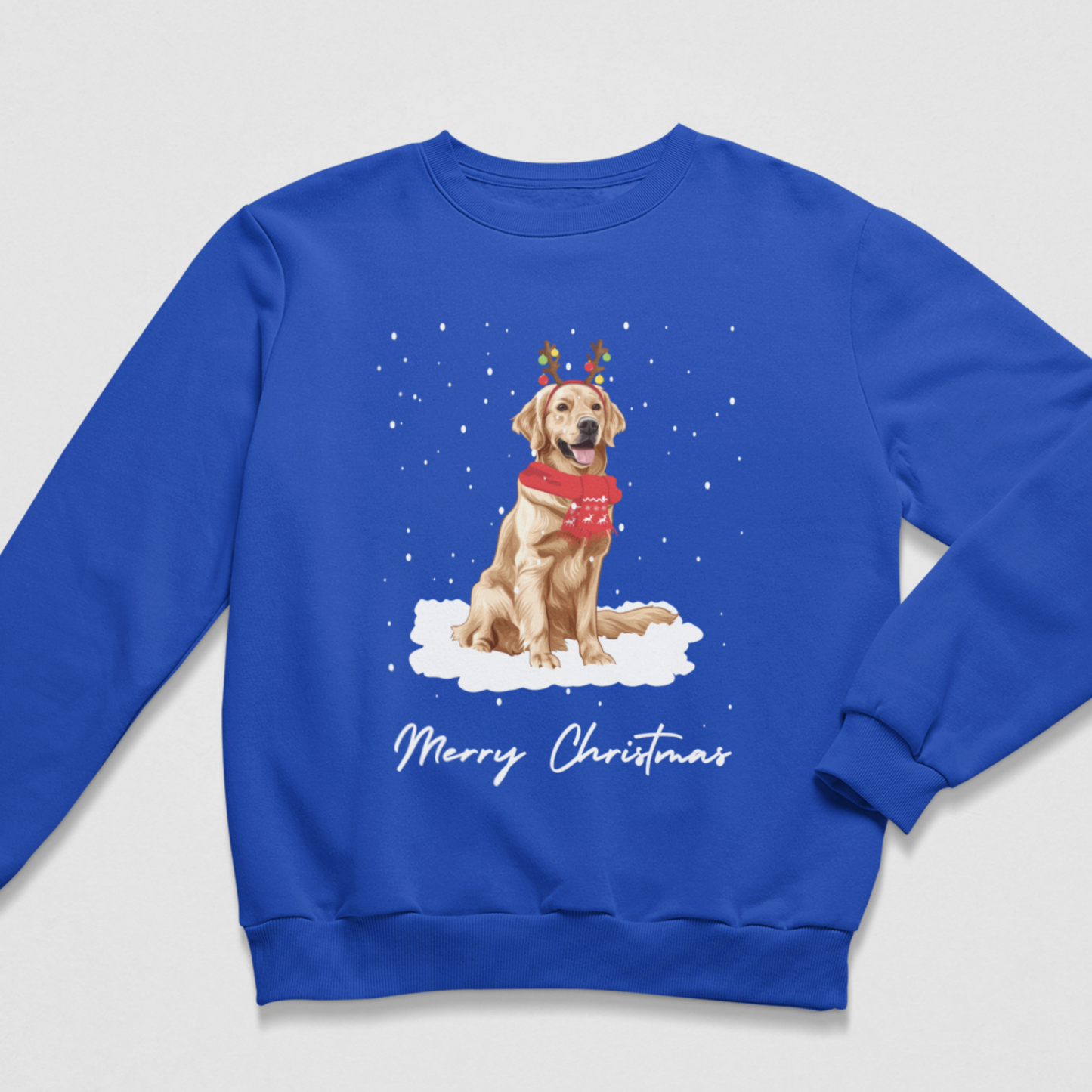 Royal blue kids Golden Retriever Christmas jumper featuring a festive dog in reindeer antlers and red scarf with snowy Christmas design.