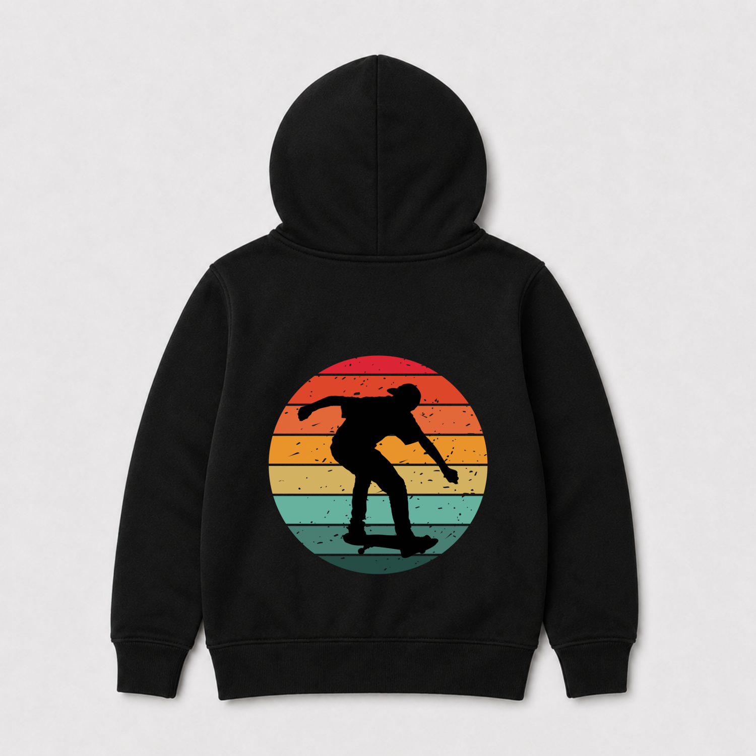 A kids black hoodie shown from the back, featuring a large circular graphic of a skateboarder's silhouette against a retro sunset gradient background.
